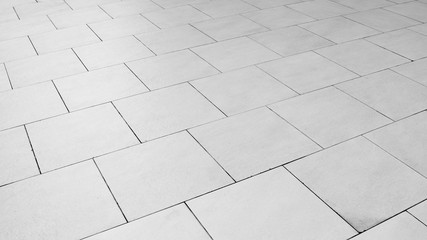 patterned paving tiles, ceramic brick floor background - monochrome