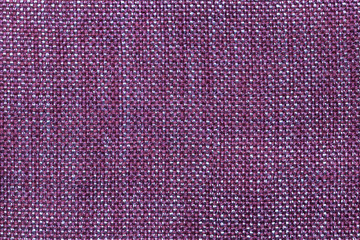 Dark violet textile background with checkered pattern, closeup. Structure of the fabric macro.