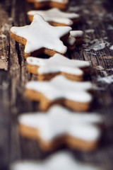 traditional cinnamon stars on dark wooden background