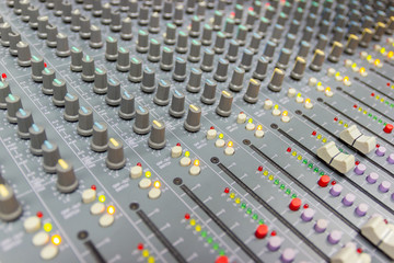 Fototapeta premium Close up Mixing Console of a big HiFi system, The audio equipment and control panel of digital studio mixer