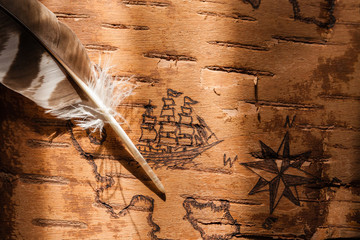 Sea map with illustrations of sailing vessels and compass rose on the order of antiquities on birchbark