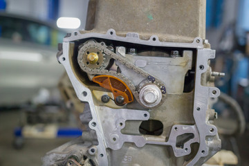 Detail of the car engine with gears and chain