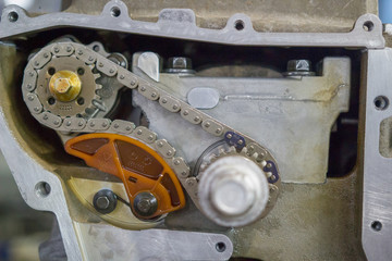 Detail of the car engine with gears and chain. Close up