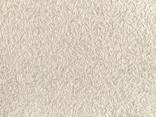 Texture of light beige wallpaper with a pattern