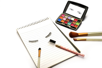 Eye makeup equipment and dairy isolated on white background. Eye makeup brochure isolated on white background.