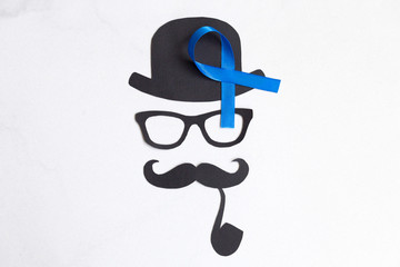 Male silhouette pattern with blue ribbon symbol. November concept.