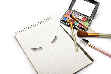 Eye makeup equipment and dairy isolated on white background. Eye makeup brochure isolated on white background.
