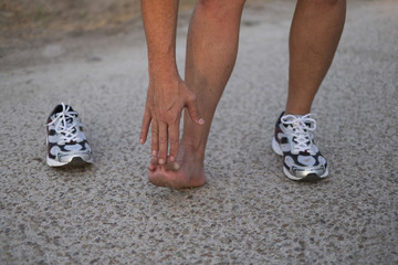 sportsman doing leg stretches