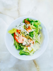 Delicious fresh salad and olive oil