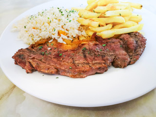 juicy steak beef meat with tomato and french fries