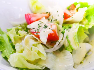 Delicious fresh salad and olive oil