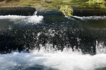 a picture of raging water in a waterfall