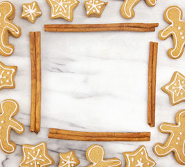Frame of Holiday Gingerbread Cookies on a Marble Counter