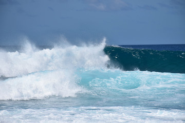 Huge waves crashing down into a frothy ocean, Pasta Point, Maldives.