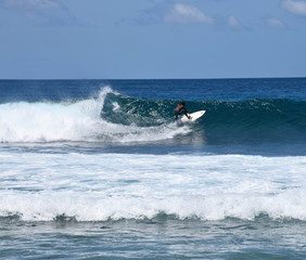 Man surfing a huge wave at Pasta Point, the Maldives