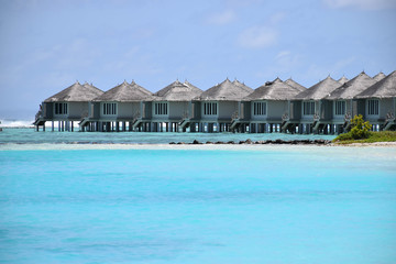 Over-water bungalows, in the turquoise waters of the Indian Ocean, maldives
