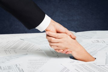 Close up of businesswoman hand in stack