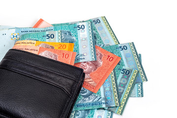 Men’s PU leather wallet and Malaysia Ringgit on white background..