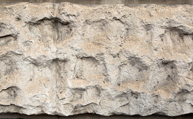 old granite plastered wall with cells, colored spots
