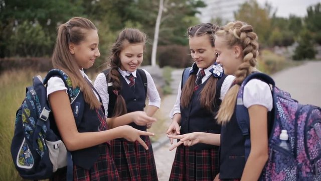 Cute schoolgirls student couple in school uniform are having fun playing