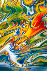 Abstract colorful image of spilled oil paint