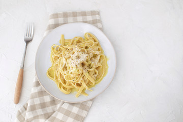 Healthy food low fat Vegetarian carbonara with zucchini Checkered napkin Slow carb dinner top view White background Copy space Horizontal