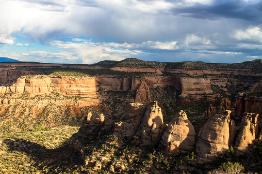 Warm sunset light on the "coke ovens" formations and massive walls of Monument Canyon at Colorado National Monument