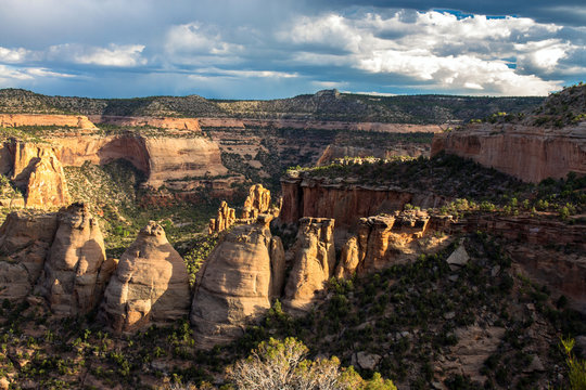 Warm sunset light on the "coke ovens" formations and massive walls of Monument Canyon at Colorado National Monument