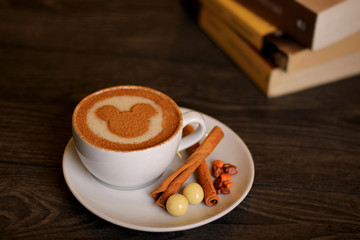 Hot beef and cinnamon drink with biscuits and stories and chocolates