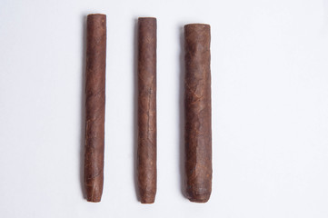 Cuban cigars on white background