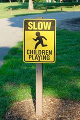 A children playing caution sign on a closeup view.