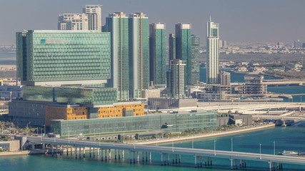 Obraz na płótnie Canvas Aerial skyline of Abu Dhabi city centre from above timelapse