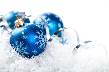 Blue Christmas Baubles on Snow Close-Up