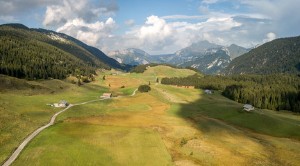 Plateau des Glieres in the French Alps on a sunny day with white clouds in the background