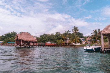 Fototapeta na wymiar Tropical huts on Bacalar's lake and blue sky