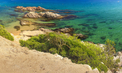 Amazing view on summer spanish beach of Platja de Santa Cristina on clear day. Beach in Lloret de Mar, Costa Brava, Spain. Vacation on Mediterranean sea.