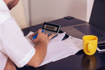 business man planning family budget and finances at home..