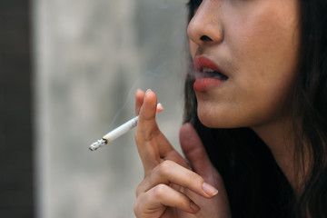 Selective focus,Beautiful Woman Smoking Cannabis Joint,copy space.