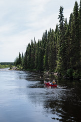 Canoe fishing on the river