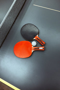 Ping-pong table with rackets and tennis ball
