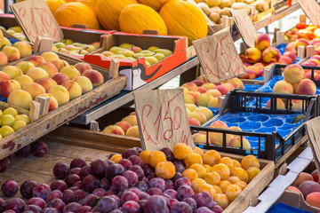 Fruit boxes with plums and peaches