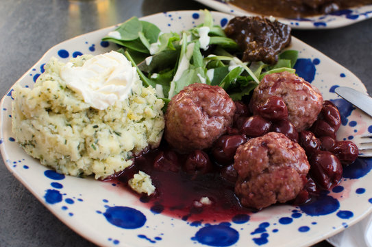 le boulet  with cherry sauce and mash