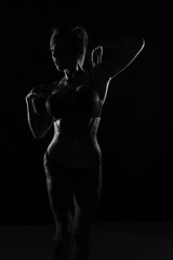 Monochrome bodyscapes of a fit tattooed woman