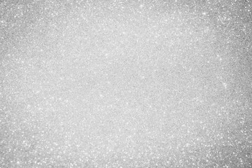 white and silver background with abstract glitter lights. bling blur for christmas background