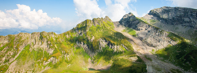 Fototapeta na wymiar Green caucasus rocky mountain landscape, natural travel background. Banner photo