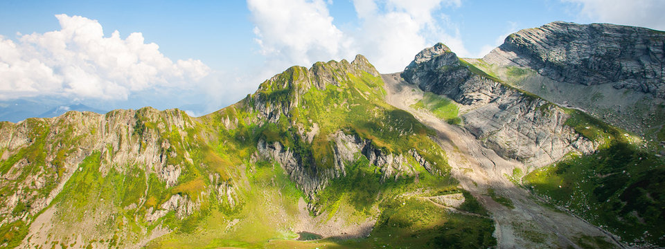 Green caucasus rocky mountain landscape, natural travel background. Banner photo