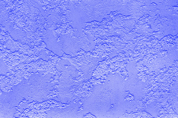 Texture of violet plaster on the wall