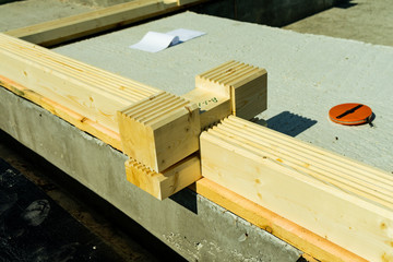 Construction of a wooden house made of profiled laminated veneer lumber. Bookmark corners.