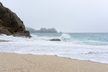 Fototapeta na wymiar Sea view with rocks and sand