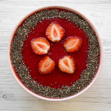 Pink Bowl Of Strawberry Smoothie With Chia Seeds, Top View. From Above, Overhead. Close-up.